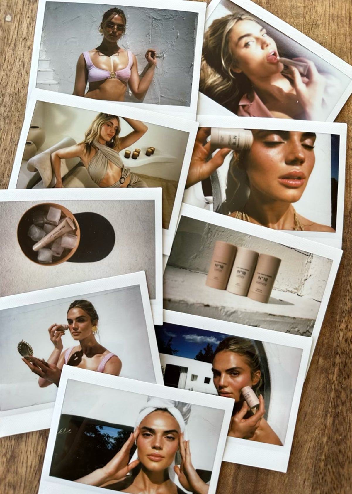 Polaroid-style prints showing a model applying skincare and three beige cylindrical products labeled N°18 on a wooden table