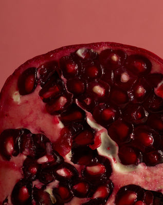 Close-up of pomegranate seeds representing the product’s pomegranate extract