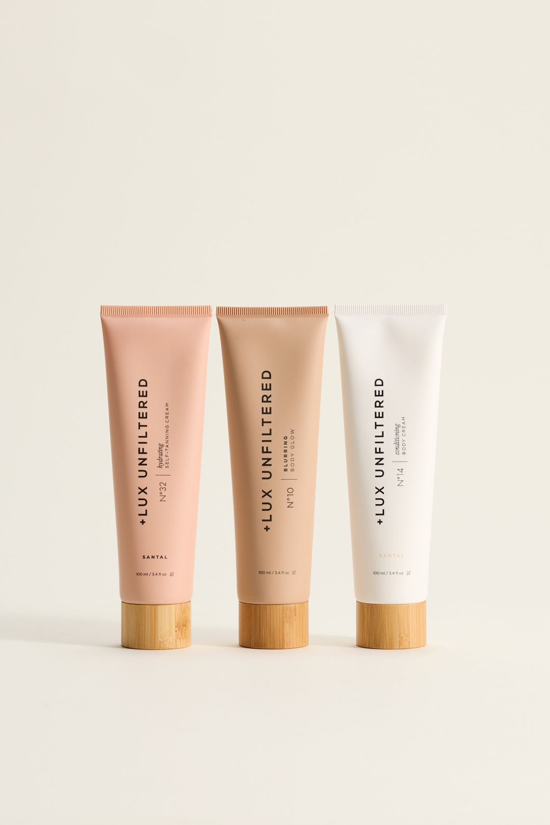 +LUX UNFILTERED tubes labeled N°32 SELF-TANNING CREAM; N°10 BLURRING BODY GLOW; N°14 BODY CREAM; SANTAL; 100 ml / 3.4 fl oz